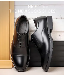 High-quality close-up detail of black genuine leather men's cap-toe business oxford shoes