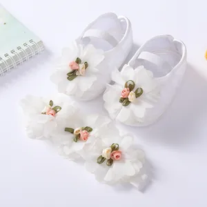 White soft sole baby princess shoes and matching floral headband set for newborns