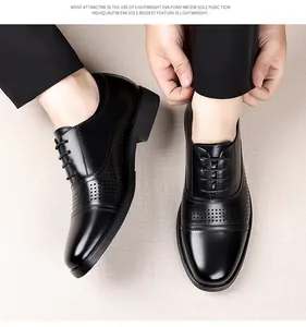 Close-up of men's black leather dress shoes with brogue detailing and EVA sole