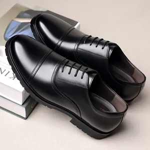Detailed view of black genuine leather triple-toe Oxford dress shoes for men