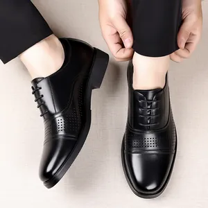 Detailed view of men's black leather business dress shoes with cap-toe design