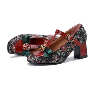 Side detail of vintage floral Mary Jane high heels with beaded bow decoration