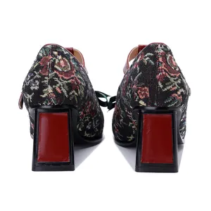 Rear view of vintage floral tapestry Mary Jane shoes with red chunky block heels