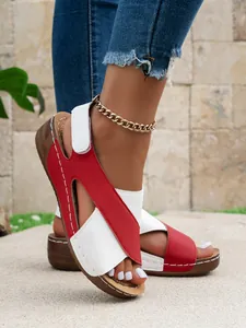 Detail view of women's red and white platform Roman sandals for summer