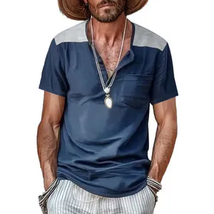 Detailed shot of a men's short-sleeved Henley shirt with color-block V-neck and chest pocket
