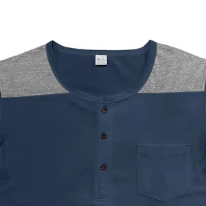 Close-up of men's color block Henley shirt with button placket and chest pocket detail