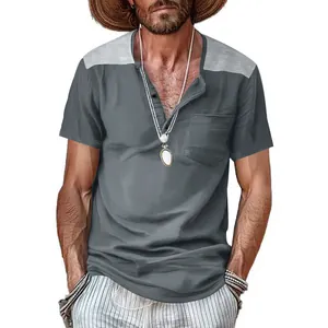 Detailed view of men's gray short-sleeve Henley shirt with contrast shoulder panels