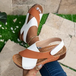 Stylish women's platform Roman sandals with brown and white cross straps for summer