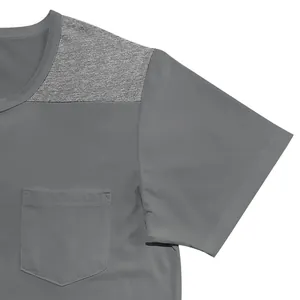 Close-up detail of men's gray short-sleeve shirt with color-block shoulder and chest pocket