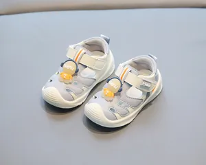 Detailed close-up of toddler closed-toe beach sandals with a cute astronaut decoration