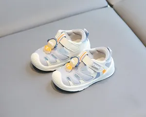 Detail view of breathable baby sandals with cute bear character ornament
