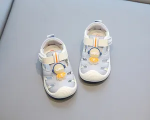 Close-up of toddler closed-toe beach sandals with cute cartoon astronaut decoration.