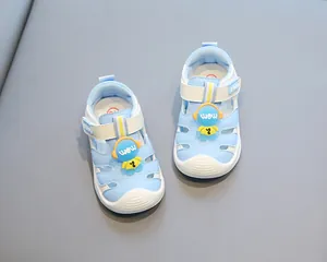 Detailed view of light blue toddler closed-toe sandals featuring a cartoon character