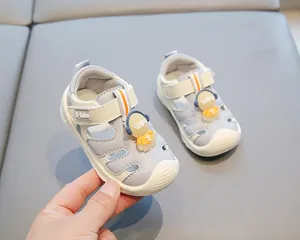 Detailed view of baby walking sandals with cute astronaut and soft non-slip sole
