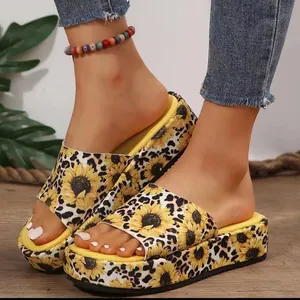 Stylish women's platform slide sandals with vibrant leopard and sunflower print patterns