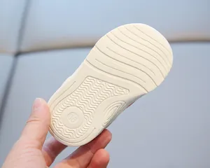 Detail view of the anti-slip soft sole with wavy patterns for toddler walking shoes.