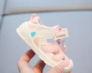 Close-up detail of pink toddler closed-toe beach sandals with a soft non-slip rubber sole