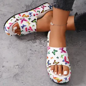 Stylish women's platform slides featuring vibrant butterfly prints on white straps.