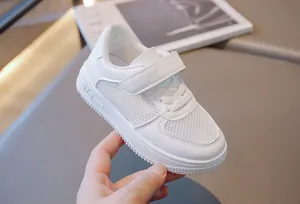 Detailed view of white breathable mesh children's board shoe with velcro strap closure