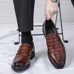 Classic men's brown loafers featuring a stylish crocodile skin embossed pattern design