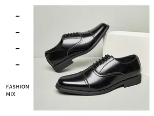 Polished black leather cap-toe Oxford shoes for formal business or wedding attire.
