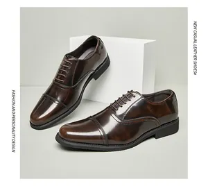 Close-up detail of premium polished brown cap-toe leather dress shoes for men