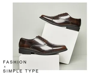 Dark brown polished leather oxford shoes displayed on white geometric blocks
