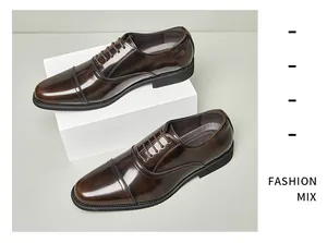 Detailed view of polished brown leather Oxford shoes for men on white display stand