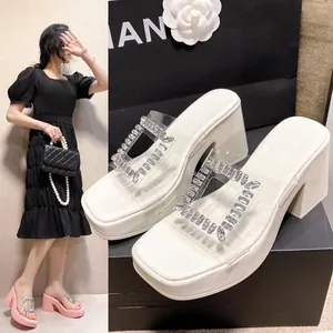 Detail view of white platform sandals with rhinestone buckle and model wearing pink version
