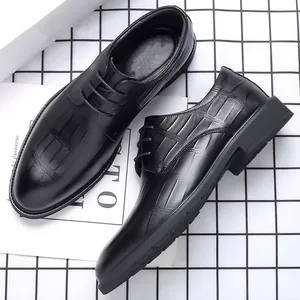 Classic black men's business leather dress shoes with textured pattern detail