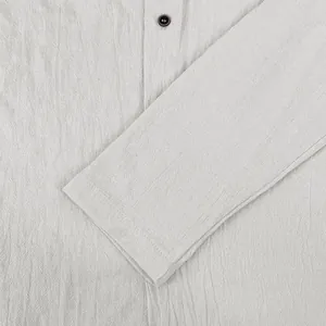 Detailed close-up showing the breathable cotton linen fabric and sleeve of men's casual shirt