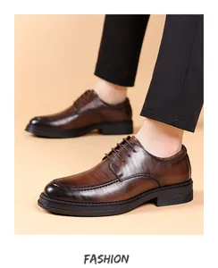 Close-up of brown leather business dress shoes with burnished toe and stitching details