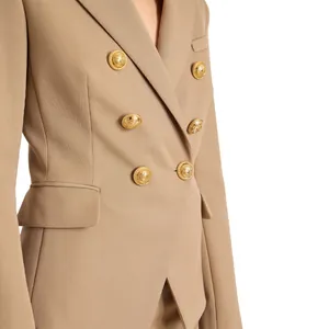 Detailed shot of premium gold-plated brass buttons on a tailored blazer.