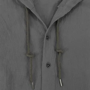 Close-up detail of men's gray cotton linen hooded shirt showing drawstrings and buttons