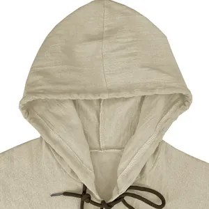 Detailed view of the drawstring hood and textured linen fabric of the men's shirt