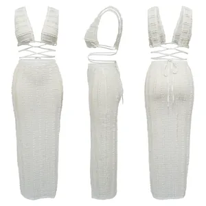 Three-angle view of white textured lace two-piece set with crop top and maxi skirt