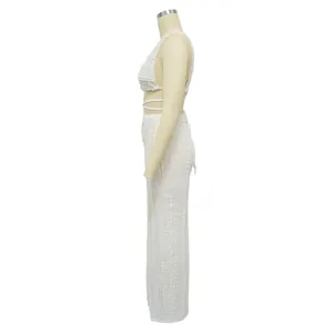 Side view detail of white lace two-piece set with sleeveless backless top and long skirt