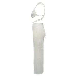 Side profile of white textured lace two-piece set with backless top and matching pants