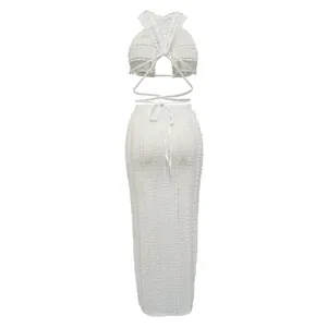 Back view detail of white lace sleeveless halter crop top and long maxi skirt set