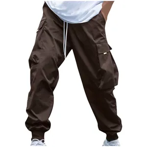 Close-up of brown men's cargo pants featuring multi-pockets and drawstring waist.