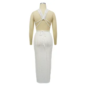 Detailed back view of the white lace two-piece set featuring a halter backless tie design