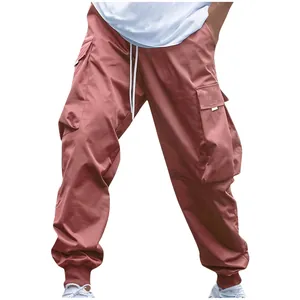 Detailed view of men's loose fit cargo pants with multi-pockets and elastic cuffs