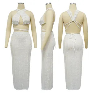 Detailed front side and back view of white lace halter crop top and long skirt set