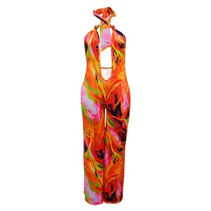 Detailed front view of a vibrant floral print halter neck backless wide-leg jumpsuit.