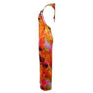 Side profile detail of vibrant floral print halter backless jumpsuit for fashion