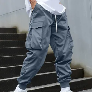 Detailed view of these urban grey loose-fit cargo jogger pants with multiple side pockets