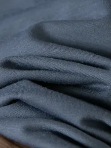 Macro detail of high-quality dark grey knitted fabric for men's polo shirt