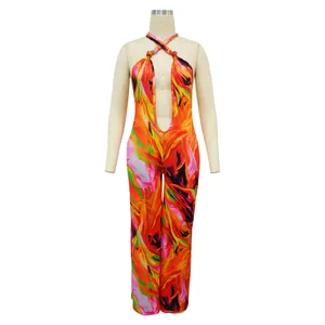 Detailed view of vibrant abstract floral print halter jumpsuit with deep V-cut design
