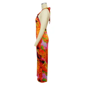 Professional side view of vibrant floral print halter backless jumpsuit on a mannequin