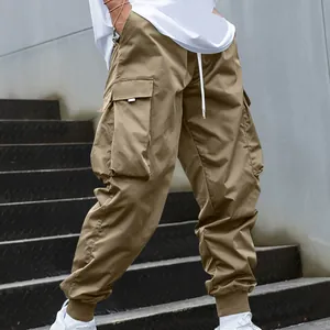Side view of men's khaki cargo pants featuring large utility pockets and jogger cuffs.